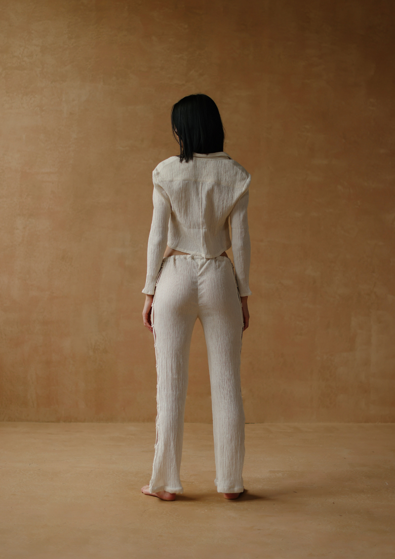 crinkled cotton trousers with macrame insert In natural
